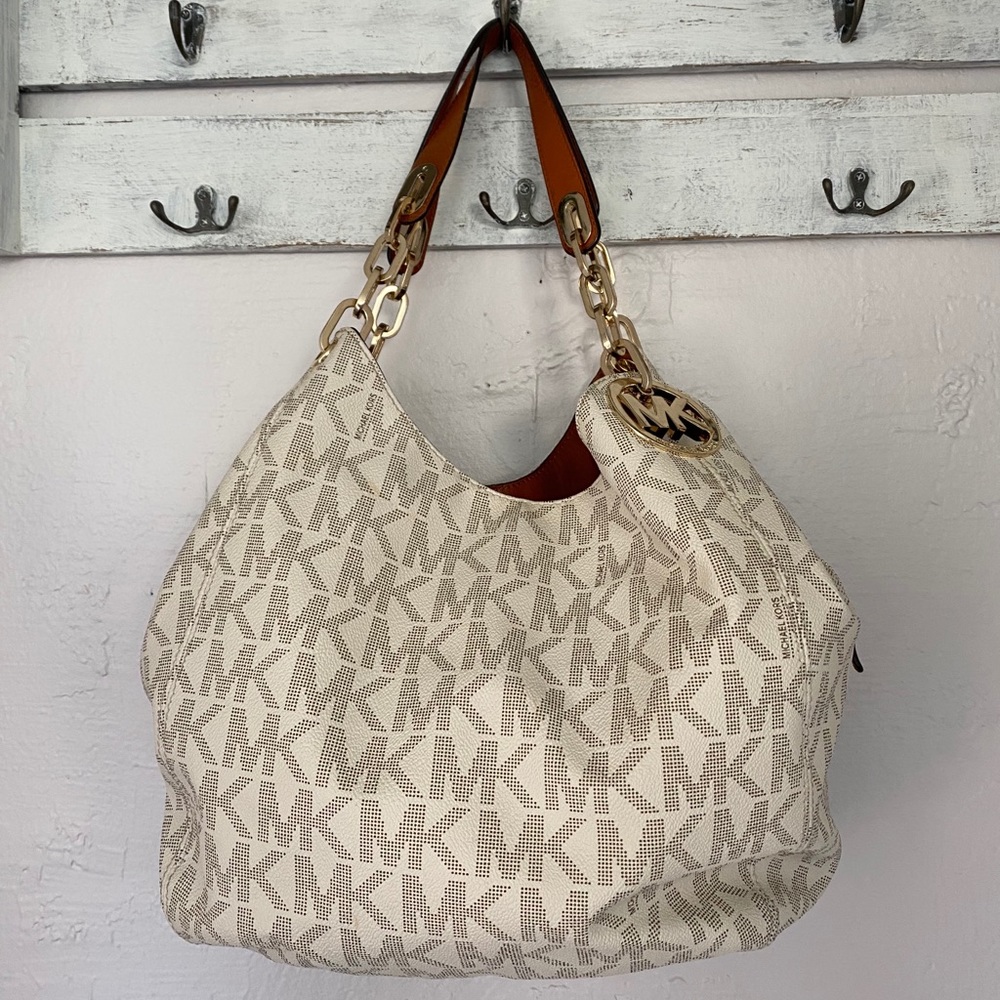 Large Michael kors handbag with matching wallet.